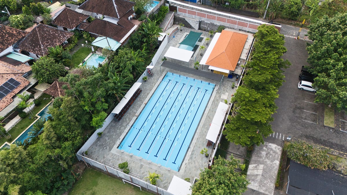 Aerial view of a large competition pool and surrounding complex
