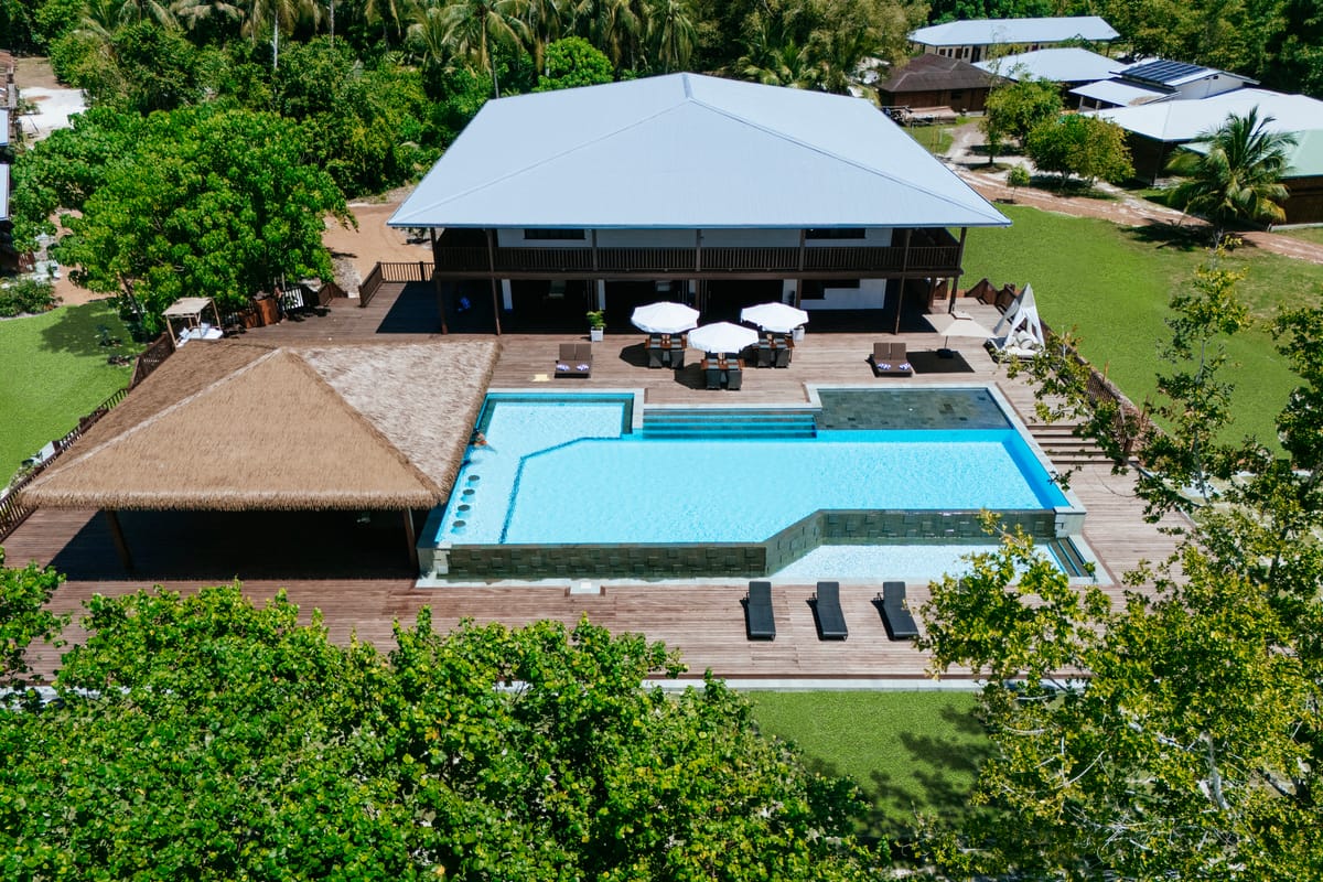 Contemporary pool with crisp stone coping and a sculpted deck in Bali