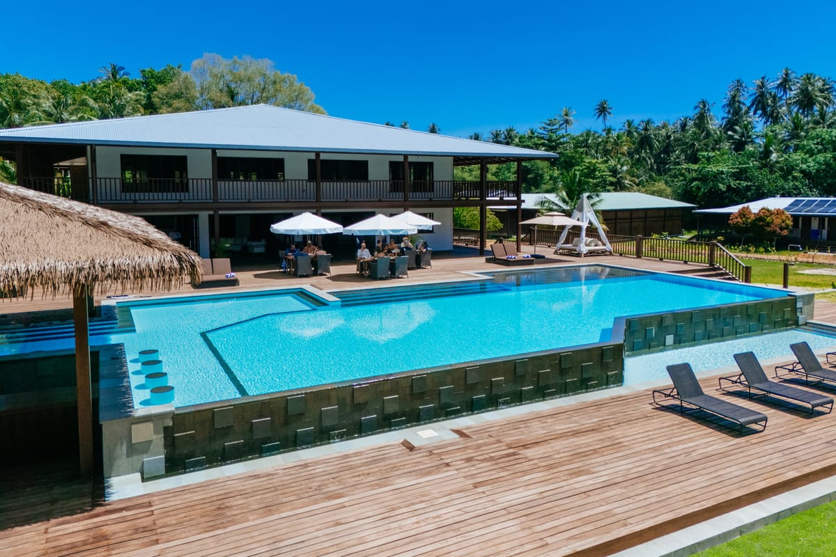 Architectural pool and lounge deck at a modern villa in Bali
